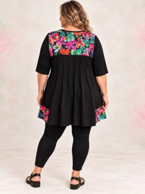 Rainbow Floral plus size pintuck top, back view, pintucked black back with bright flower print yoke and hem panels - Hayley Joy